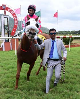 Secret Shadow (Shamaz Shareef up), winner of the GIRINAGARA PLATE (DIV-II) being led in by trainer Mansoor Khan on Wednesday races at Mysore.